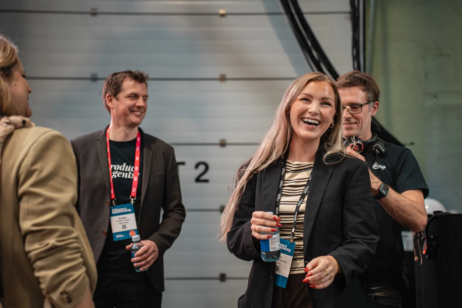 Anna Sophie Christensen and Kasper Refskou Jensen laughing backstage after the talk